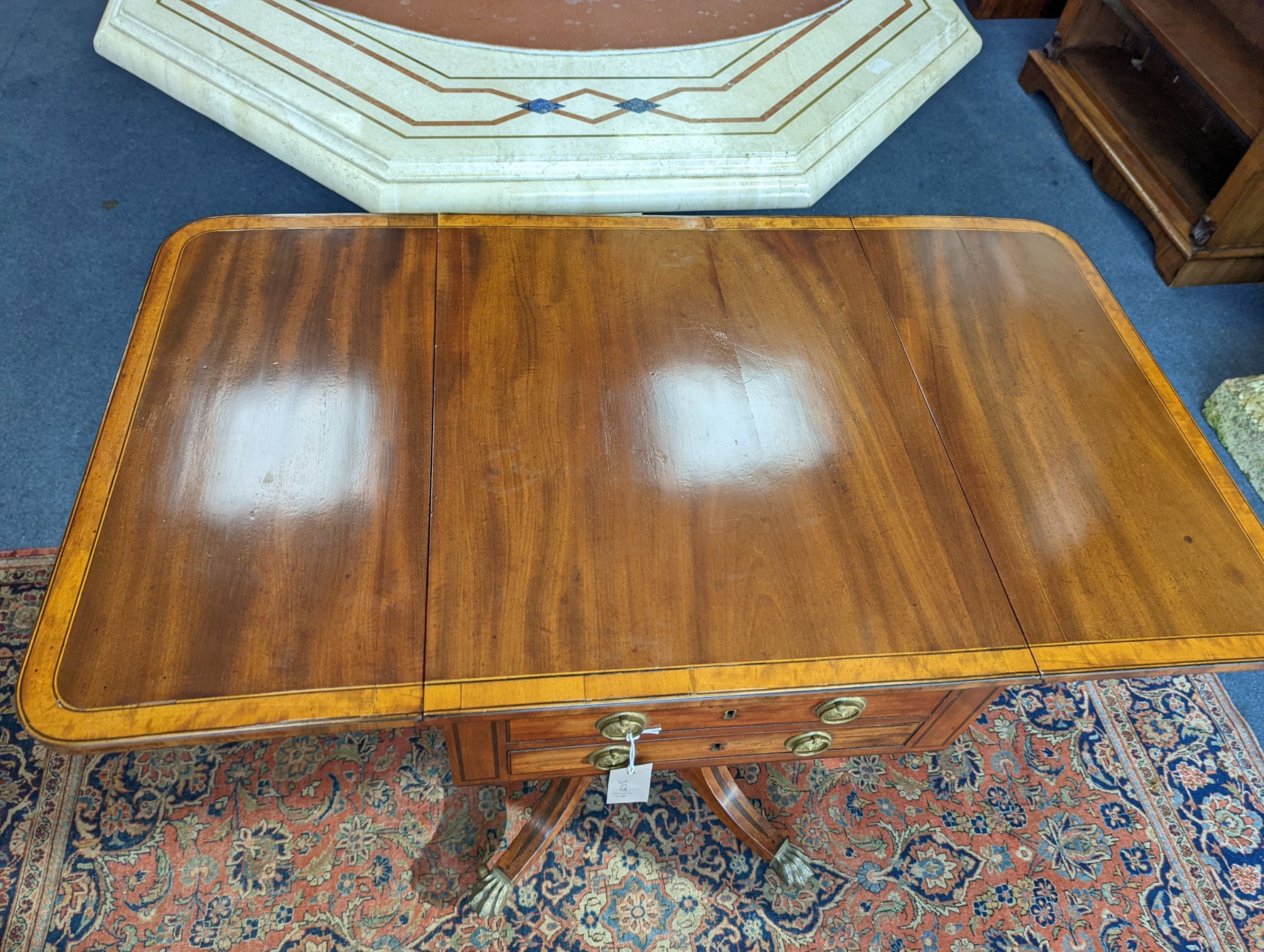 A Regency satinwood banded mahogany drop flap centre table, width 98cm extended, depth 56cm, height 73cm